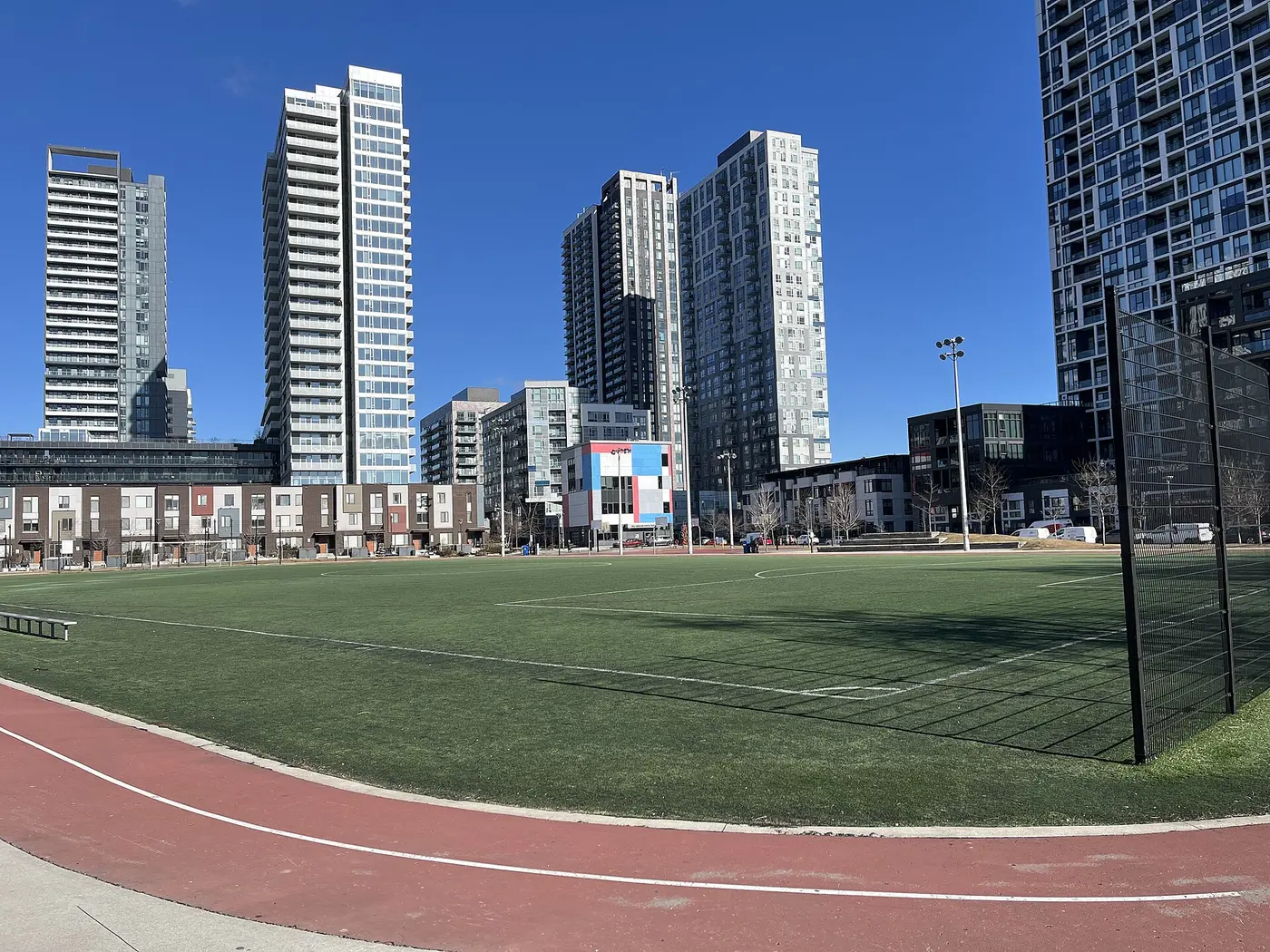 Regent Park Athletic Grounds on Sumach St: soccer pitch and red running track